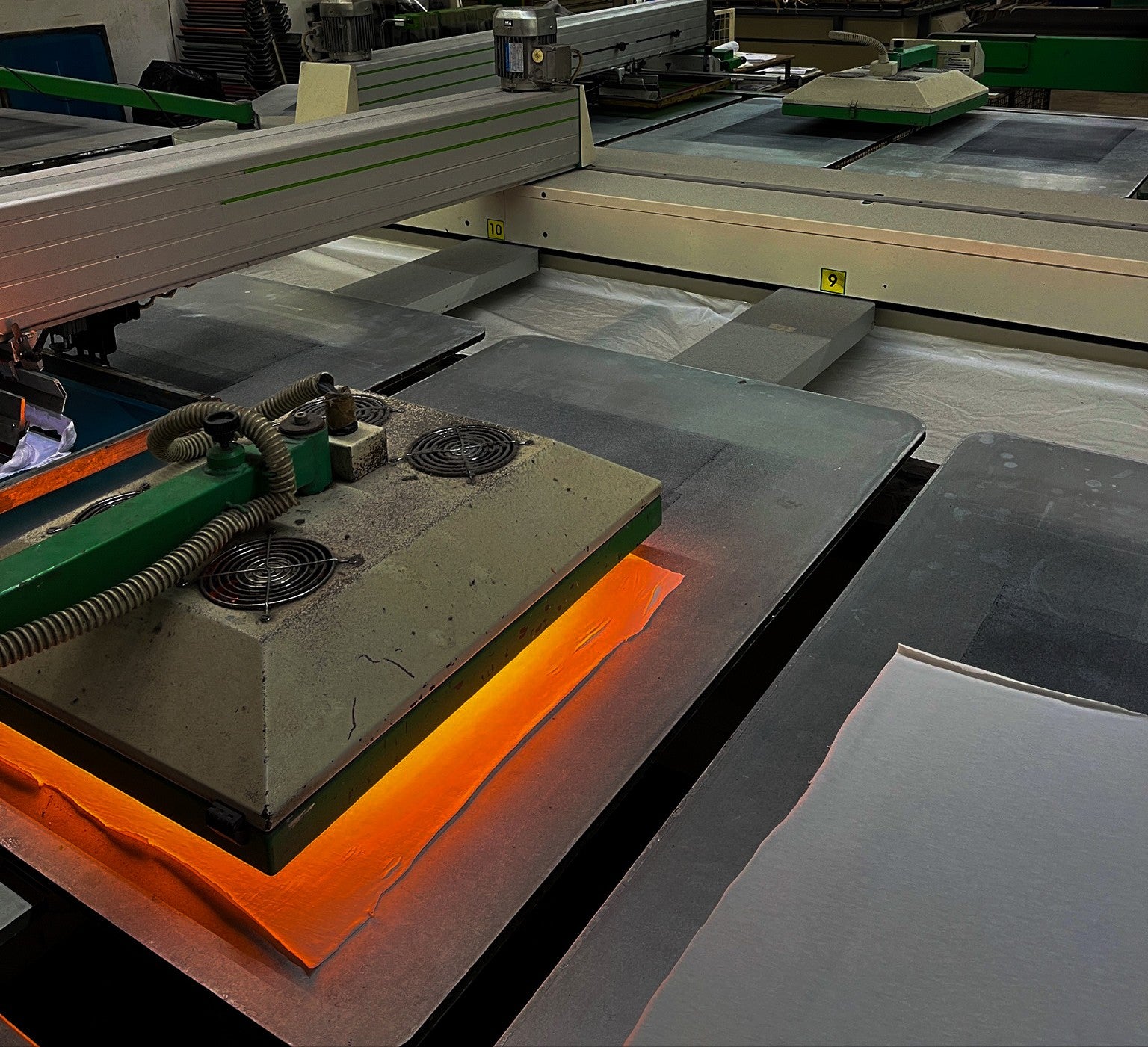 Close-up of heat press machine in a potential Portuguese clothing factory for Origin.
