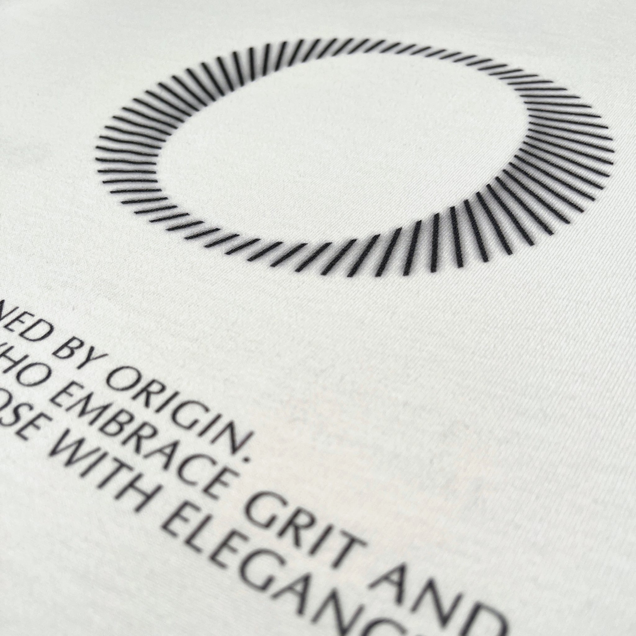 Back detail of The Slash Tee Origin. in white, featuring back screen print on organic cotton fabric.